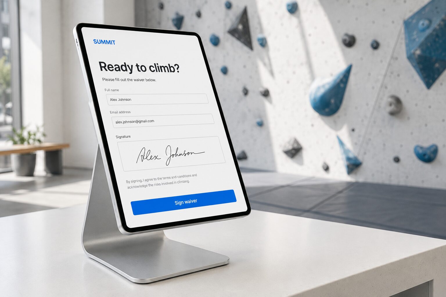 Waiver signing on a tablet at a climbing gym reception